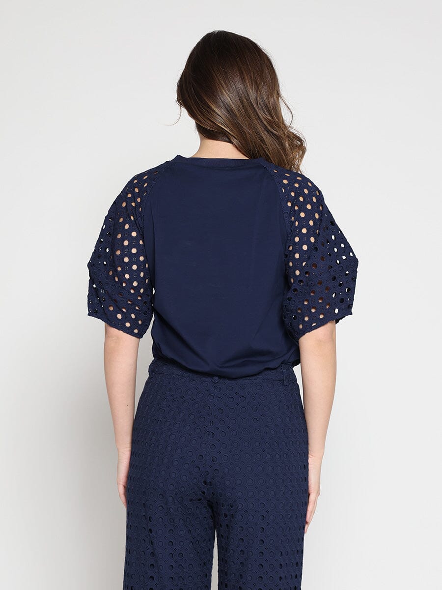 Eyelet sleeve and solid body crew neck top