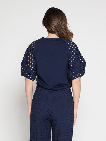 Eyelet sleeve and solid body crew neck top